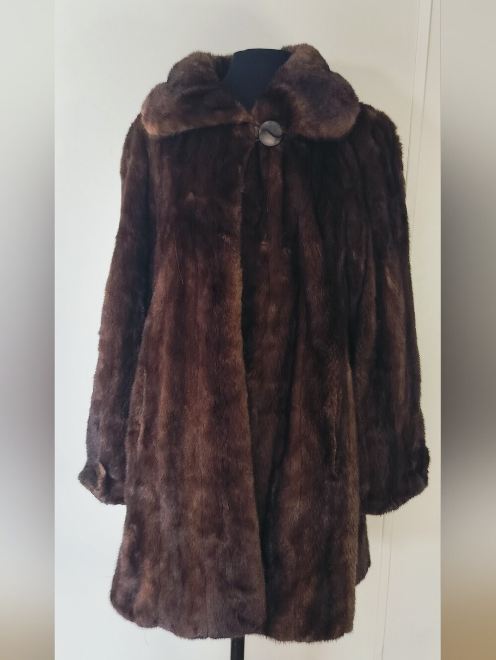 Dark brown vintage mink coat with a wide collar